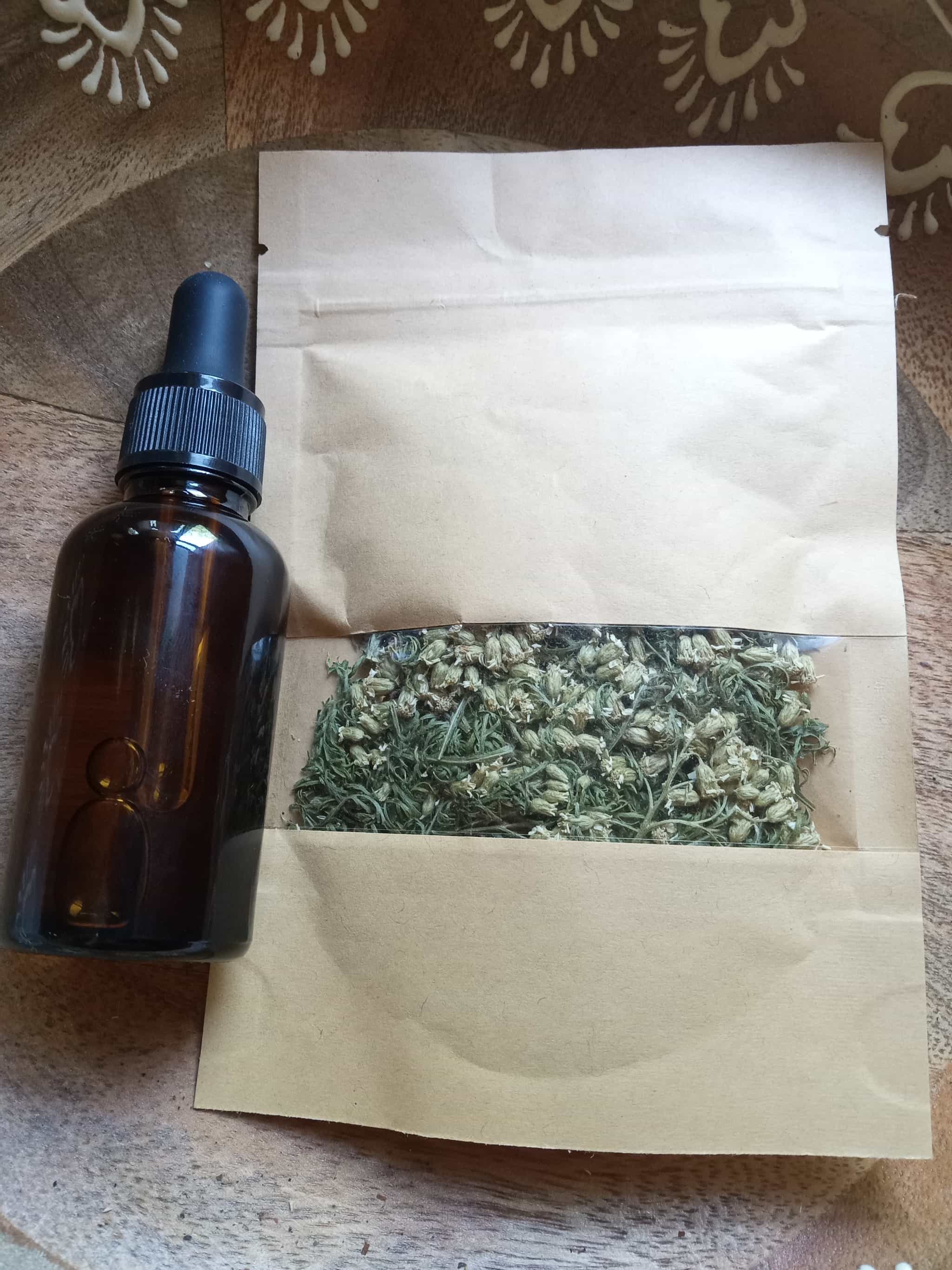 Wildcrafted yarrow oil with dried flower and leaf