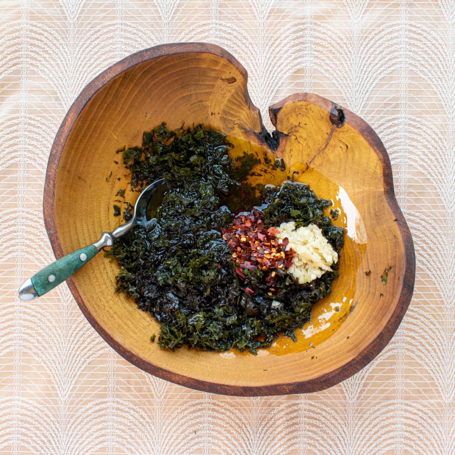 Add garlic, red pepper, vinegar, and olive oil