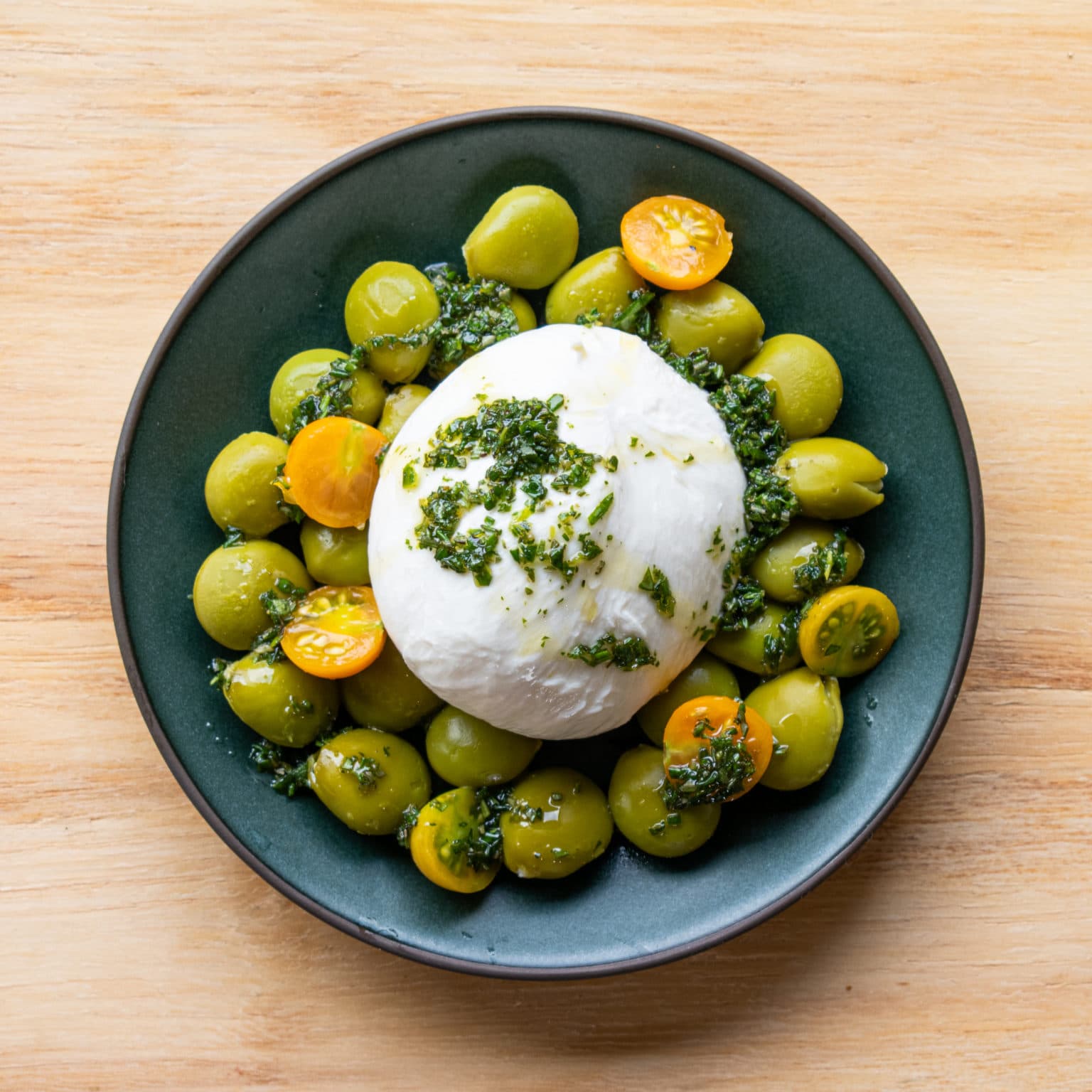 Add tart tomatoes and drizzle with herb oil