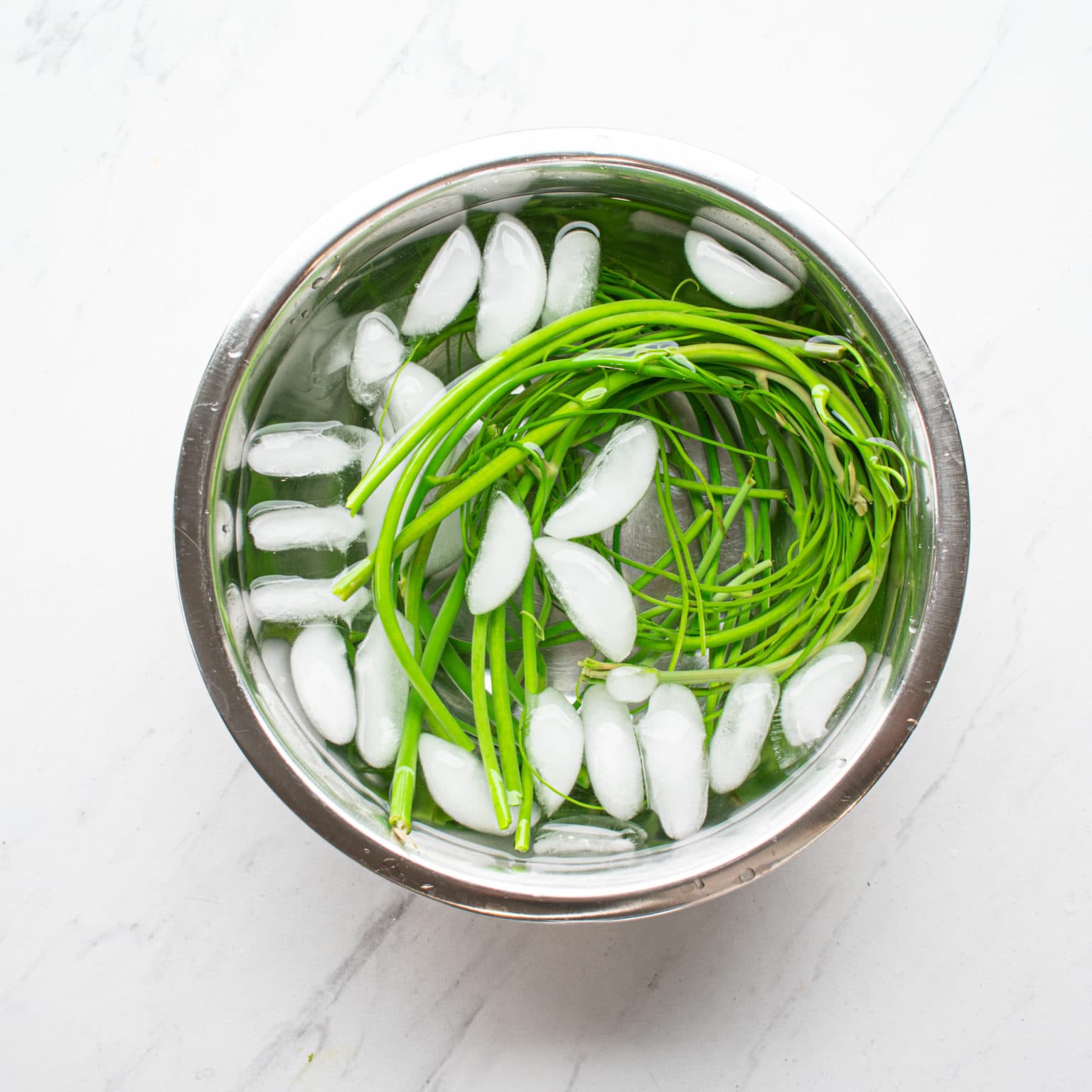 Blanch in boiling water and and shock in ice water
