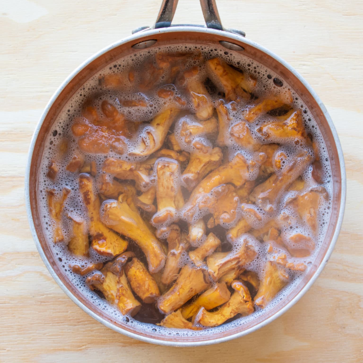 Simmer chanterelles in brine