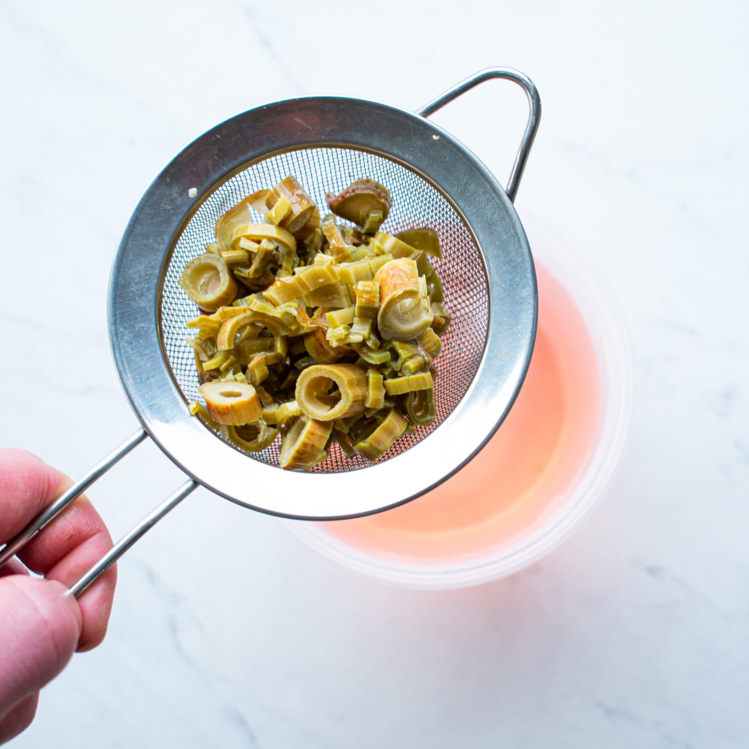 Strain out knotweed pieces