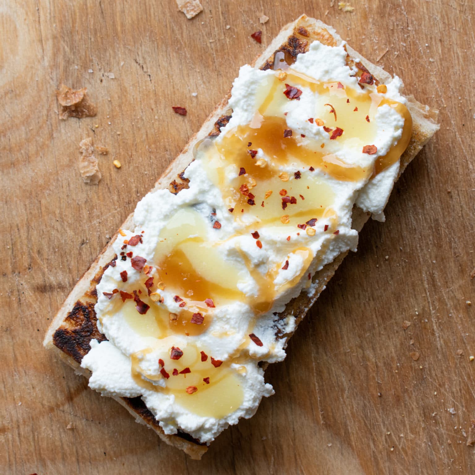 Top with honey, red pepper flakes, and flakey salt